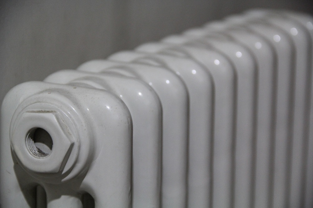 A closeup shot of white radiator on a blurred background