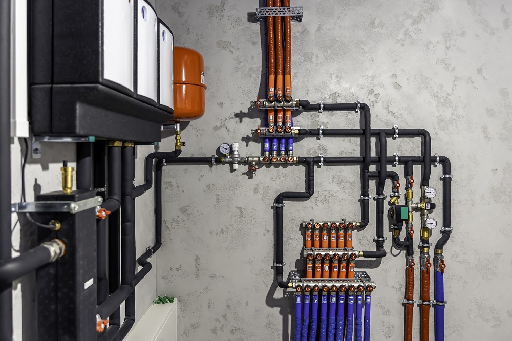 A modern electric boiler room. Equipment for modern heating system as a boiler, heater,pipes, expansion tank and other.